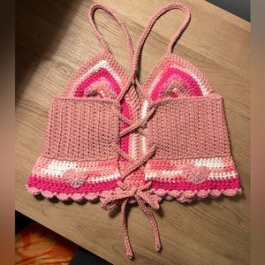 Hand crocheted, lace up top made with 100% cotton yarn.